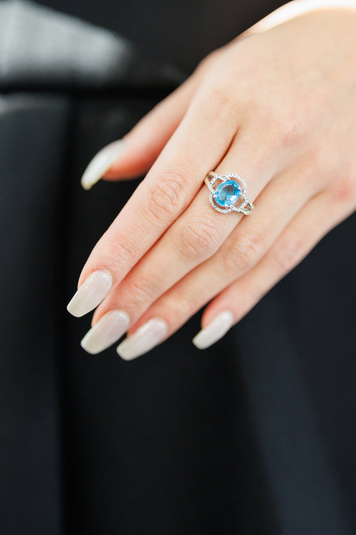 Celestial Blue: Topaz Halo Ring With Adjustable Band