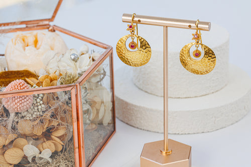 Earrings shown on stand